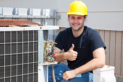 Air conditioner repair in Bay Head technician giving a thumbs up in front of an outdoor unit